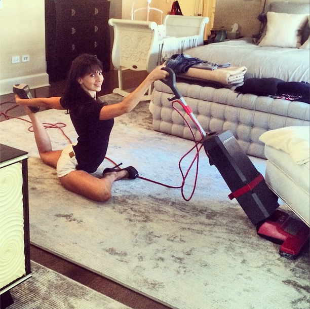 Hilaria Baldwin Vacuuming while Striking a Pose - Via Instagram.